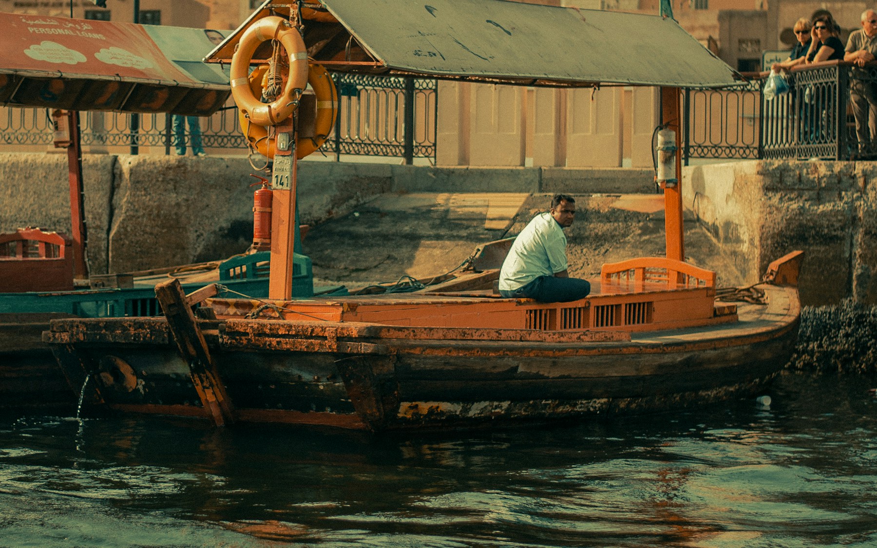 An abra boat operator on Dubai Creek