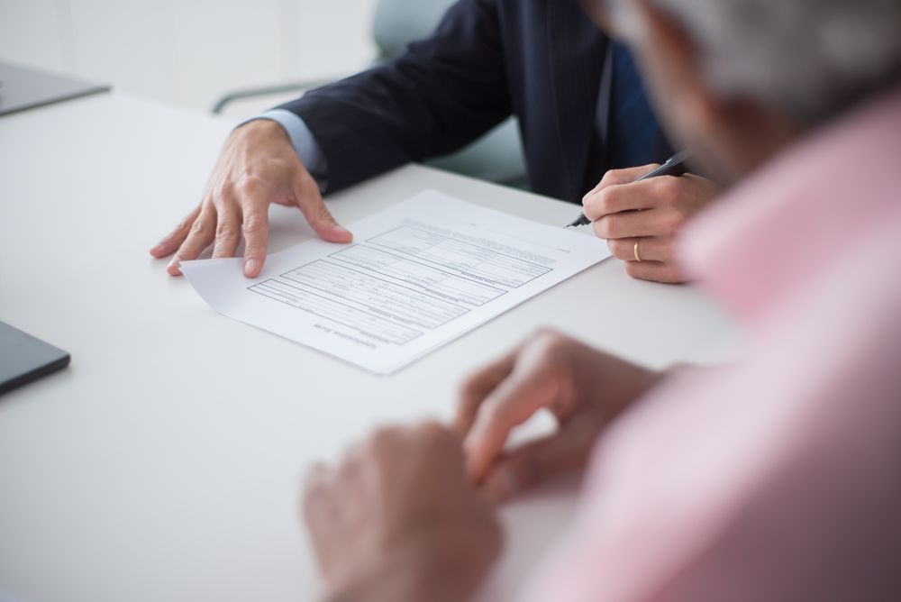 Signing business documents during a meeting