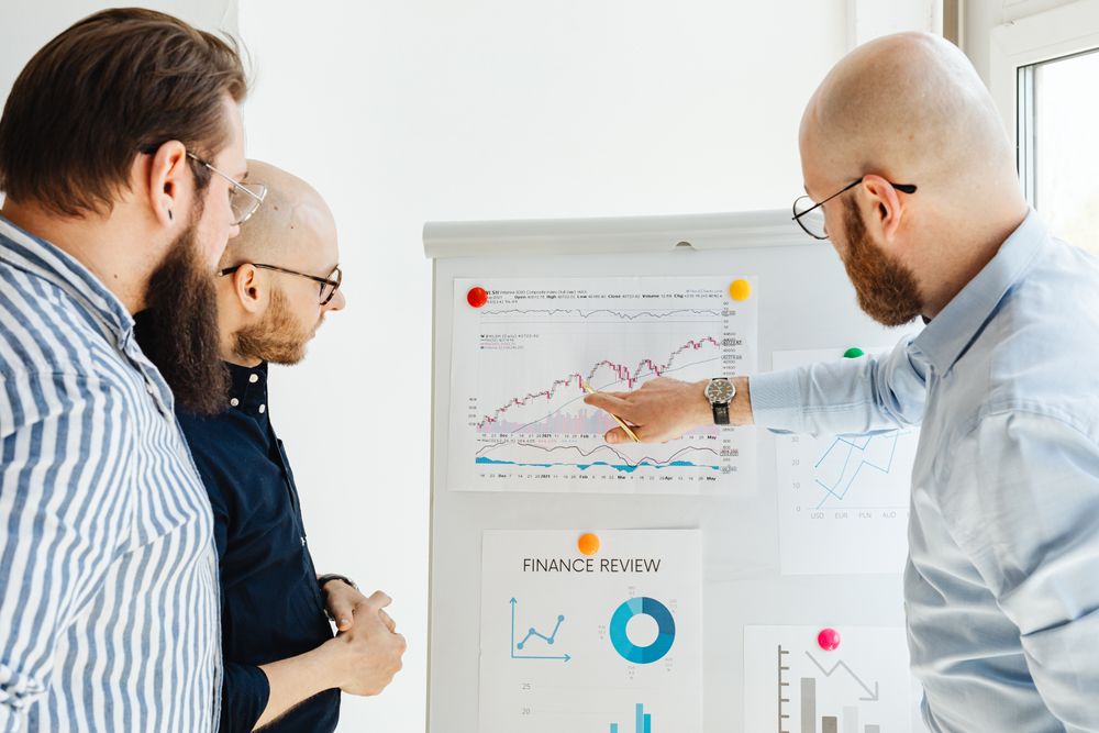 Business owners reviewing a company finance report